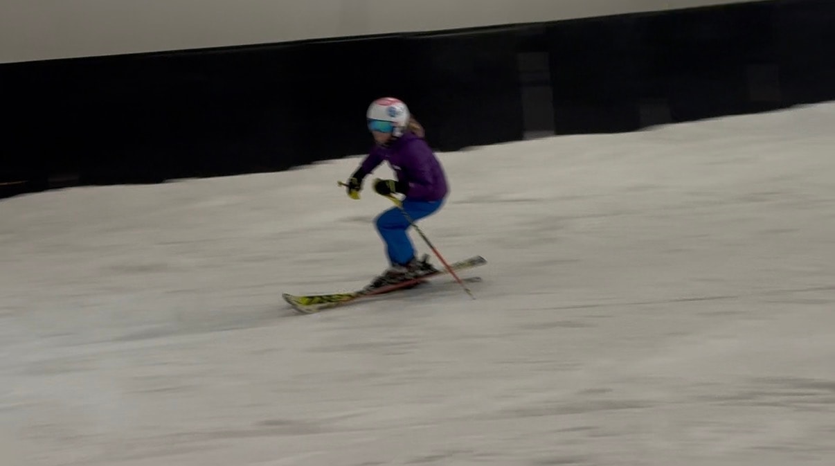 Young skier learning technique indoors