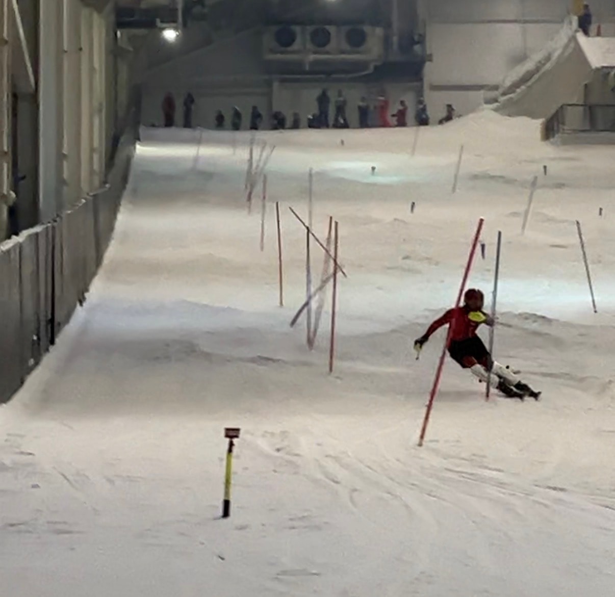 Ski instructor demonstrating on slope